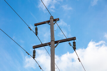 Photograph looking up at the top of a wooden telephone pole in a remote location in the Blue...
