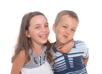 Portrait of two cheerful siblings, Little  boy and girl  goofing and laughing on white background