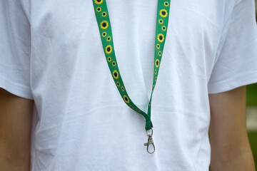 Sunflower lanyard, symbol of people with invisible or hidden disabilities.