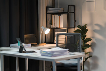 Night Grind: A home office bathed in the warm glow of a desk lamp, hinting at late-night dedication and the pursuit of productivity. 