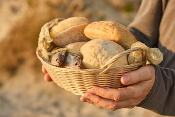 Christianity, religion, Bible concept. Five loaves of bread and two fish