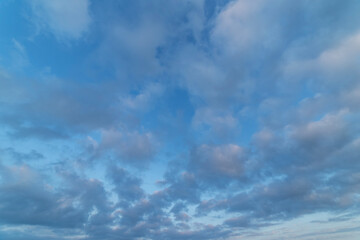Beautiful tender sunrise sky with clouds. Sky background. 