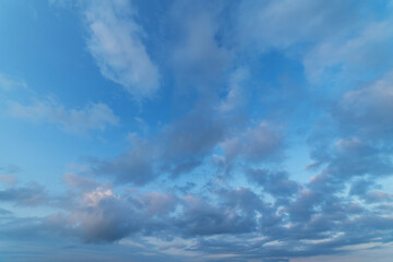 Beautiful tender sunrise sky with clouds. Sky background.