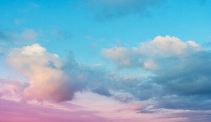 Beautiful tender sunrise sky with clouds. Sky background. 