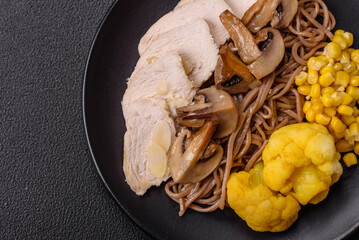 Asian dish with sliced chicken fillet, buckwheat noodles, soy sauce