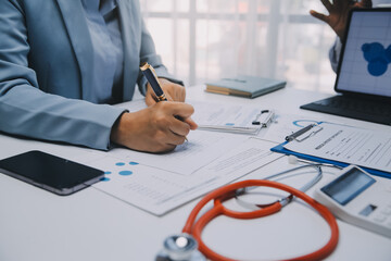 Meeting, tablet and team of doctors with collaboration for healthcare talk and telehealth app in office. Surgeon group, tech and medical discussion with website for hospital funding or sponsorship