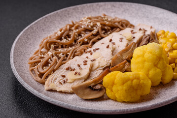 Asian dish with sliced chicken fillet, buckwheat noodles, soy sauce