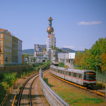Vienna, Austria: U4 train towards Schottenring against the colorful Spittelau building