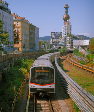 Vienna, Austria: U4 train towards Schottenring against the colorful Spittelau building