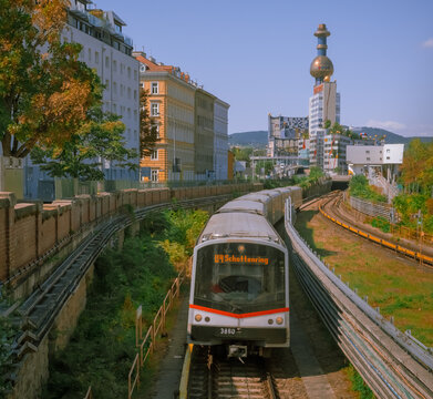 Vienna, Austria: U4 train towards Schottenring against the colorful Spittelau building