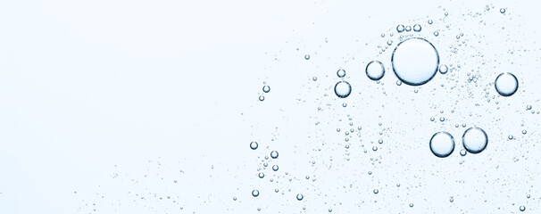 Blue texture of cosmetic serum with bubbles. Copy space.