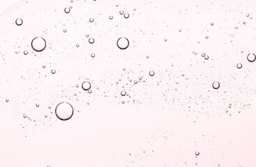 The texture of a cosmetic serum for the face or body. Closeup.