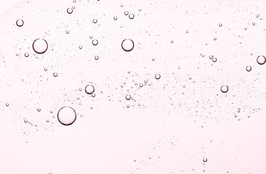 The texture of a cosmetic serum for the face or body. Closeup.