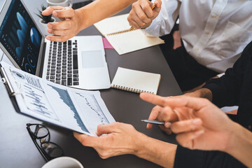 Data analysts team working analyzing business intelligence BI dashboard display on laptop to analyze financial, trend, and marketing data. BI technology and data analysis for business success. Prudent