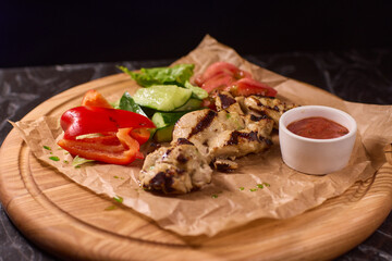 Deliciously Grilled Chicken Platter served alongside Fresh Colorful Vegetables and Sauce