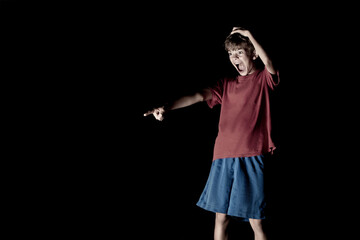 Portrait image of a boy at night in the dark