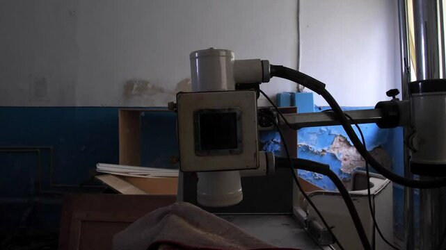 old x-ray machine of an abandoned hospital