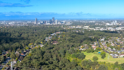 Drone aerial photograph of houses and the general landscape and precinct heading towards to the city of Parramatta in the greater Sydney region of New South Wales in Australia.