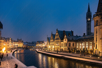 Snowy Christmas Night in Ghent, Belgium with Historic Buildings and Canal