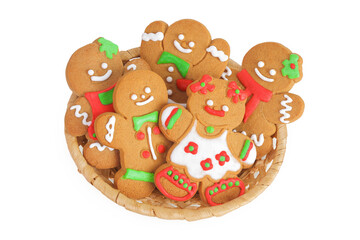 christmas gingerbread cookie in a wicker basket isolated on white background