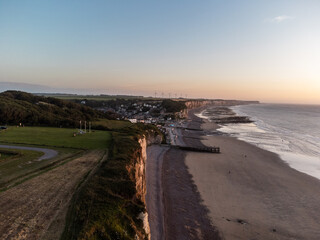 West coast of France. Clifs of Etreta. Sunset. Etretat village, Normandy region.