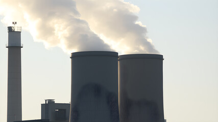 Smoke emissions from two factory chimneys causing air pollution. Generative AI