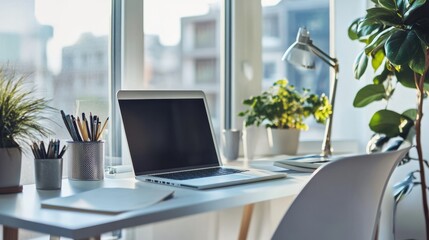 Fototapeta premium A Danish architects desk with a laptop and simple clean design