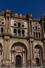 Architectural fragments of Malaga Cathedral facade. Renaissance Cathedral - Roman Catholic Church in the city of Malaga, was constructed between 1528 and 1782. Malaga, Costa del Sol, Andalusia, Spain.