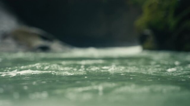 Slow Motion close up of water rushing in a tropical rainforest jungle