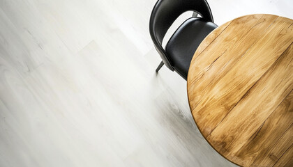 Round wooden table and black chair indoors top