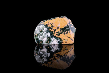 polished Ocean jasper. macro photography detail black isolated background. close-up mineral.
