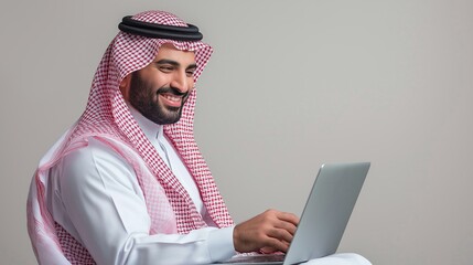 Saudi Arab Man working on laptop, isolated background 