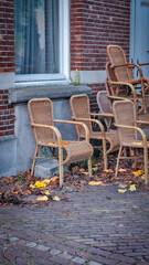 Chairs from street cafe in autumn
