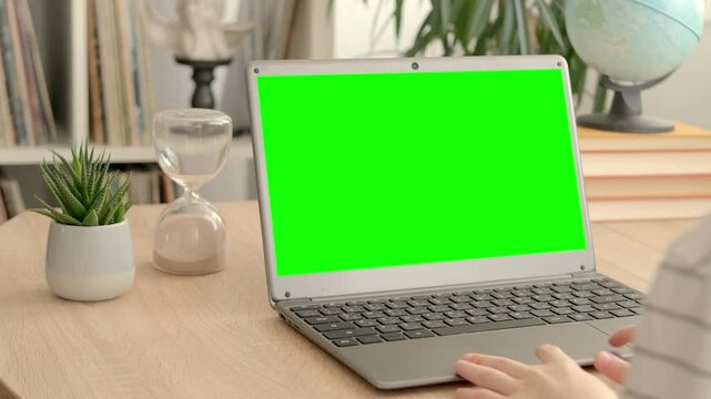 smart child, schoolboy playing with computer, developing brain games, monitor with empty green screen mockup, digital age, cyber education, concept childhood, child development, self-education