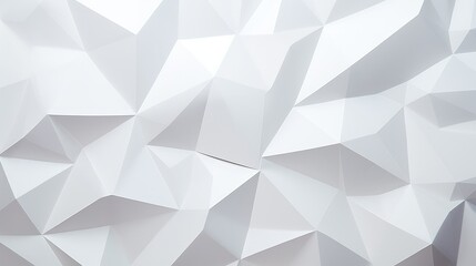 A textured white geometric wall with sharp angles and facets.
