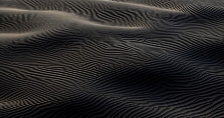 Aerial view of textured sand dunes, showcasing natural patterns and shadows.