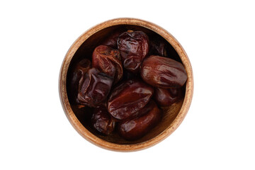 Top view of dry dates in wooden bowl over white background.