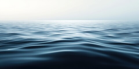 Fototapeta premium Calm Blue Ocean Surface with Gentle Waves and a Foggy Horizon