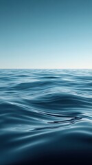 Naklejka premium Calm Ocean Surface with Gentle Waves Under a Clear Sky