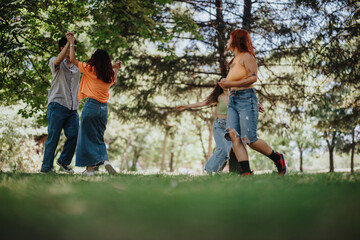 Fototapeta premium Young teenagers having fun in the park, showcasing friendship, joy, and moments of laughter and happiness.