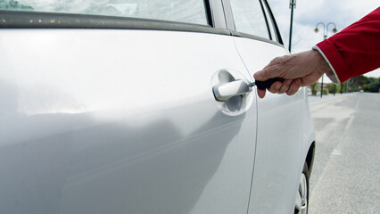 Man Opening The Car's door With The Keys 