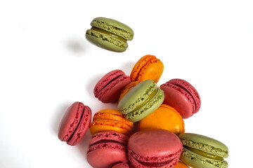 Sweet colorful macaroons isolated on a white background. Delicious colorful macarons. Sweets isolated on a white background. Photos of cookies for banners and websites.