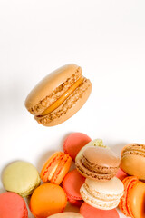 Sweet colorful macaroons isolated on a white background. Delicious colorful macarons. Sweets isolated on a white background. Photos of cookies for banners and websites.