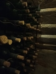 Bottles of wine stored in an old cellar in the basement
