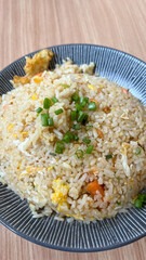 Seafood fried rice with shrimp and egg on a table