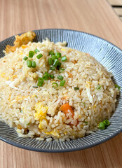 Seafood fried rice with shrimp and egg on a table
