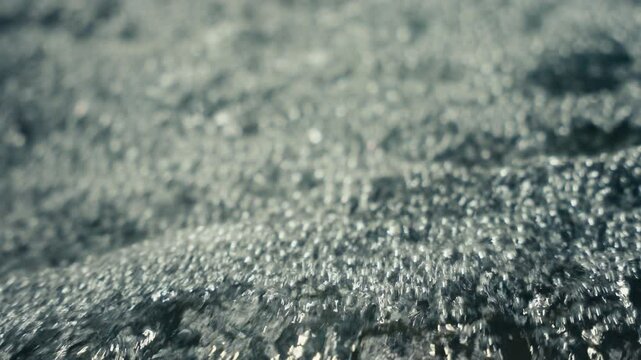 Slow Motion close up of water rushing in a tropical rainforest jungle
