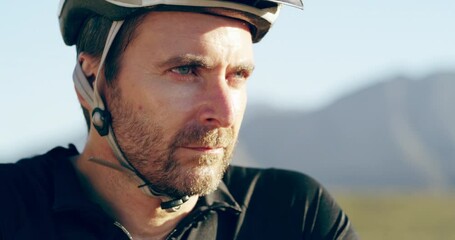 Face, thinking and man with bicycle helmet for cardio exercise, triathlon and race outdoor in sunshine. Serious athlete, break and training on mountain bike for fitness, cycling and sports adventure