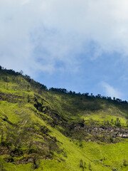 Fototapeta premium Old crater walls in Bromo Tengger Semeru National Park including farm land in the foreground.