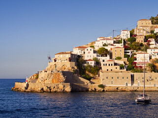 Hydra island port and sea view in sunset colors. Saronic Gulf, Greece 